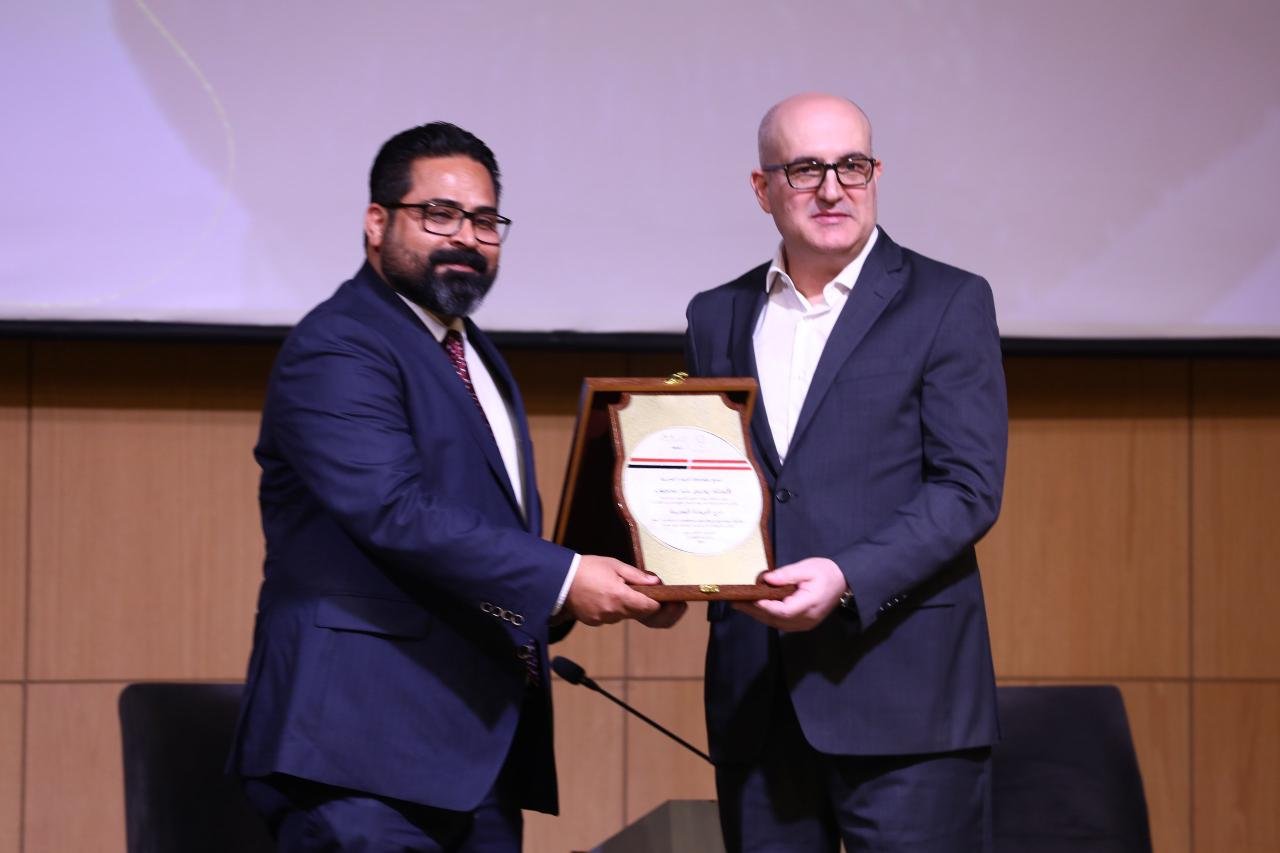 the arab leadership shield being presented to the president of east gate for sustainable development