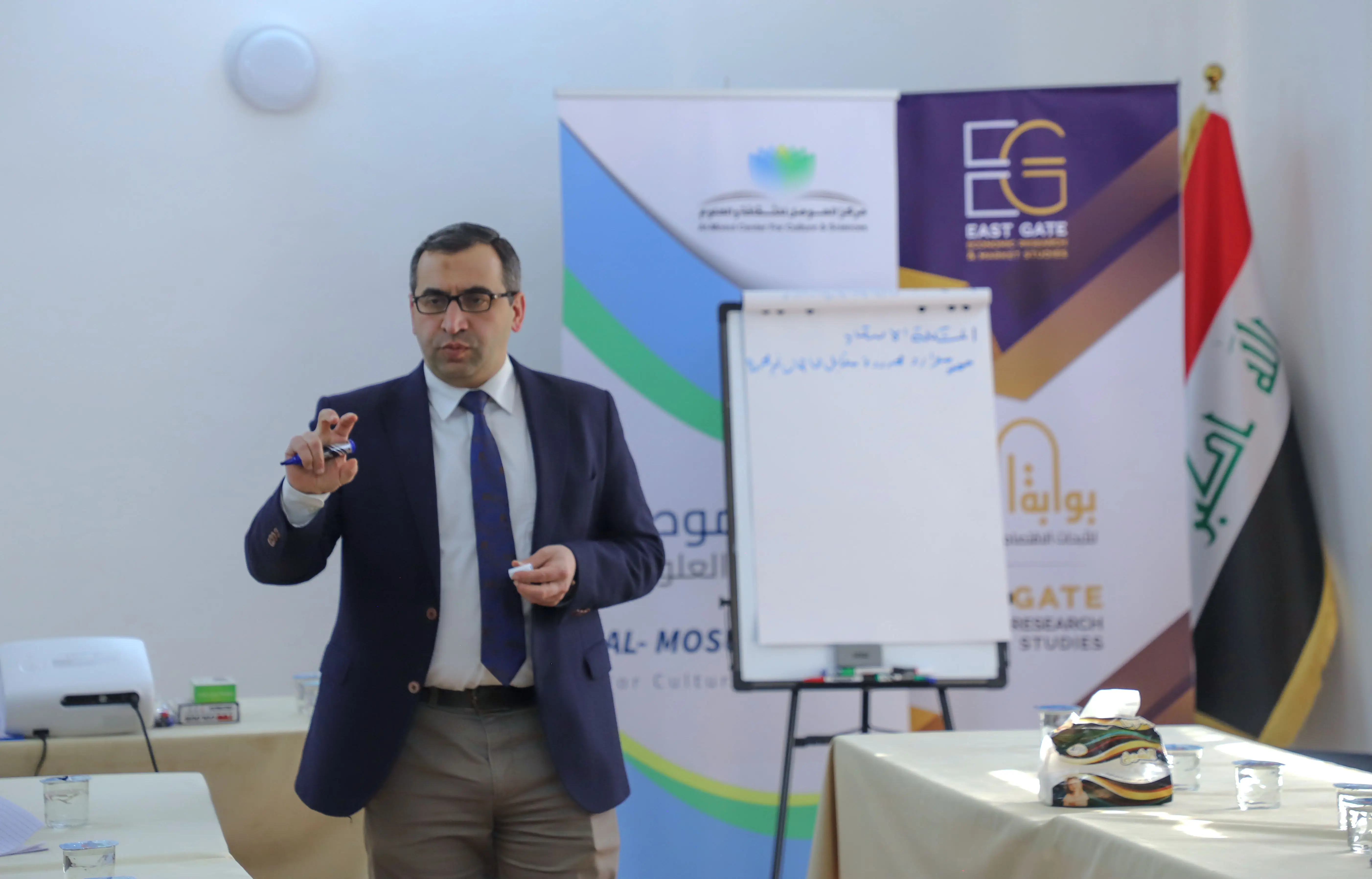 start your business course beneficiaries sitting at tables in al mosul center hall